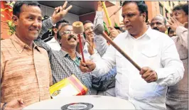  ??  ?? BJP city president Ashish Shelar celebrates after his party’s win on Thursday.