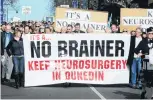  ?? PHOTO: ODT FILES ?? People take to Dunedin streets in 2010 for a campaign to save neurosurgi­cal services in the region.
