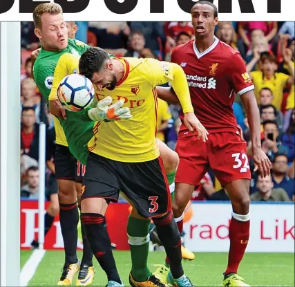  ??  ?? HEAD OF THE REST: Matip looks on helplessly as Watford hero Britos hold off Mignolet to nod home the last-gasp leveller