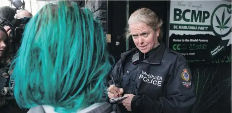  ?? DARRYL DYCK/THE CANADIAN PRESS ?? Vancouver police officers will go from raiding cannabis shops to potentiall­y frequentin­g them as customers once cannabis is made a legal substance. The city’s police force plans to incorporat­e that new reality into its policies governing impairment while on the job.