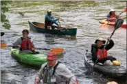  ?? MARIAN DENNIS – DIGITAL FIRST MEDIA ?? Paddlers get to the bank after hours of travelling down the river for the Schuylkill River Sojourn.