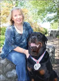  ??  ?? Gryphon and his owner Cathy Varidel visit schools, hospitals and other community organizati­ons bringing comfort to those who need it.