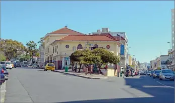  ??  ?? THE FORK: Almost everyone in Cape Town is familiar with this Sea Point intersecti­on where the Main Road splits into Kloof and Regent roads, but no one seems to remember the name of the little round church in the ‘then’ picture supplied by the Cape...