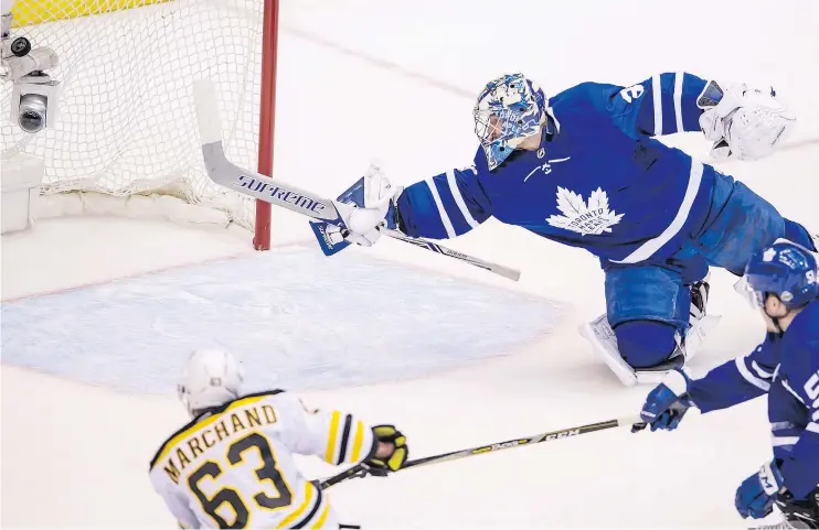  ?? — PETER J. THOMPSON ?? Maple Leafs goalie Frederik Andersen dives in vain as the Bruins’ Brad Marchand buries a shot during second period action on Thursday night in Toronto.