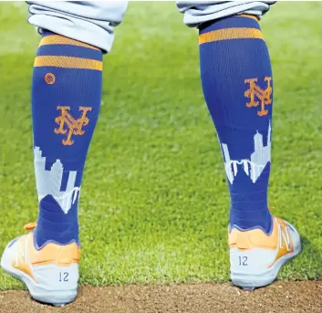 ?? WILFREDO LEE/AP FILES ?? Mets centre fielder Juan Lagares’ socks are shown before the start of a baseball game earlier this season.