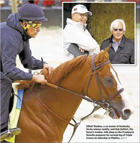  ?? GETTY ?? Elliott Walden, a co-owner of Kentucky Derby winner Justify, and Bob Baffert, the horse’s trainer, talk shop as the Preakness favorite prepares for second leg of Triple Crown on Saturday at Pimlico.