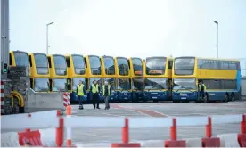  ?? Photograph: Caroline Quinn/PA ?? Dublin Bus vehicles in a depot after services were cancelled.