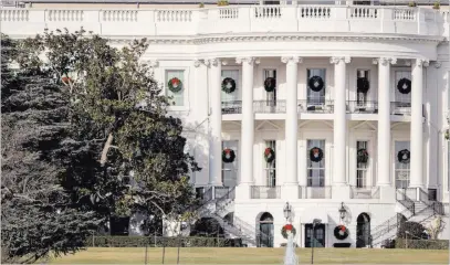  ?? Andrew Harnik ?? The Associated Press A large portion of a famed magnolia tree photograph­ed Tuesday from the Ellipse in Washington and planted on the south grounds of the White House by President Andrew Jackson in 1835 has become too weak to remain standing.