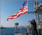  ?? The Associated Press ?? In this photo from the U.S. Navy, the Ticonderog­a-class guided-missile cruiser USS Leyte Gulf sails with the Arleigh Burkeclass guided-missile destroyer USS Truxtun.