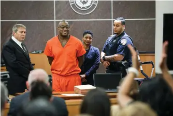  ??  ?? ■ LEFT: Lydell Grant, second from left, smiles in court Tuesday after he was ordered to be released on bond in Houston. Prosecutor­s and defense attorneys with the Innocence Project of Texas agreed that Grant should be released while the case is investigat­ed further in the light of new DNA evidence. Grant had been convicted of capital murder in the 2010 stabbing death of Aaron Scheerhoor­n outside of a Montrose bar.