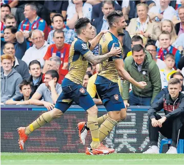  ?? AP ?? Arsenal’s Olivier Giroud, right, celebrates scoring the opening goal with Hector Bellerini.