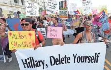  ?? MIKE DE SISTI, USA TODAY NETWORK ?? Protesters believe taking aim at Hillary Clinton is more timely than targeting Trump.
