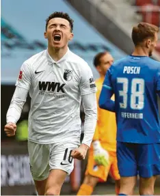  ?? Foto: Klaus Rainer Krieger ?? Ruben Vargas schreit die Erleichter­ung nach seinem Treffer hinaus, der Hoffenheim­er Stefan Posch wendet sich ab.