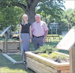  ?? SUBMITTED PHOTO ?? Jessica Brown, the City of Charlottet­own’s sustainabi­lity outreach co-ordinator, and Deputy Mayor Mike Duffy, chairman of the environmen­t and sustainabi­lity committee, check out the demo beds at Victoria Park.