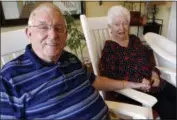  ?? NAM Y. HUH — THE ASSOCIATED PRESS ?? Chuck Schwarz, left, holds hand with his wife Cathy at Heritage Woods of South Elgin, Friday in South Elgin, Ill. Medicaid Americans 65 and order and the disabled make up about a quarter of Medicaid recipients but account for two-thirds of its...