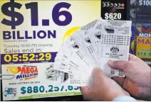  ?? Sue Ogrocki ?? The Associated Press The Mega Millions jackpot has been growing since July, when a group of California office workers won $543 million.