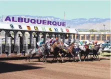  ?? JOURNAL FILE PHOTO ?? Horses leave the gate at Albuquerqu­e Downs in 2012. Live horse racing is set to resume in New Mexico in April now that public health restrictio­ns are being eased in some places in the state.