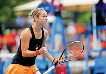  ??  ?? Oklahoma State’s Katarina Adamovic pumps her fist after scoring a point against Stanford in the NCAA Tennis championsh­ip match in May 2016 at the Michael Case Tennis Center last May in Stillwater.
[PHOTO
BY IAN MAULE, TULSA WORLD]