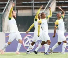  ?? GAVIN BARKER BackpagePi­x ?? LYLE LAKAY celebrates with teammates during yesterday’s derby win over SuperSport at the Lucas Moripe Stadium. |