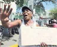  ?? FILE ?? A Tivoli Gardens resident protests deaths from the police-military assault of 2010. Here, she and scores of others marched on Gordon House on May 27, 2014, in their bid to deliver a letter to then Prime Minister Portia Simpson Miller.