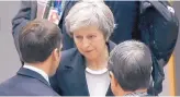  ?? THE ASSOCIATED PRESS ?? British Prime Minister Theresa May speaks with French President Emmanuel Macron on Thursday at the EU summit in Brussels. Brexit is the focus of the two-day meeting.