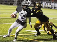  ?? BILL LACKEY / STAFF ?? Centervill­e’s Dom Ramsey tackles Pickeringt­on North quarterbac­k James Weirick during Friday’s Division I, Region 3 semifinal in Springfiel­d.