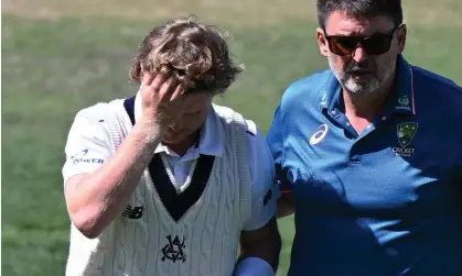  ?? ?? Will Pucovski sustained another blow to the helmet during Victoria’s Sheffield Shield match with Tasmania. Photograph: Steve Bell/Getty Images