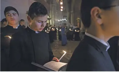  ??  ?? lefT The Armenian order at a prayer ceremony in the Church of the Holy Sepulchre in Jerusalem riGhT Every Friday, there is a multi-party procession that visits the 14 stations on Via Dolorosa, believed to be the path Jesus Christ took to Golgotha, where he was crucified.