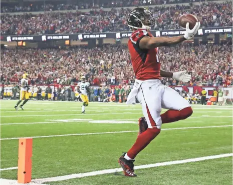  ?? JASON GETZ, USA TODAY SPORTS ?? The Falcons’ Julio Jones finishes off his 73-yard touchdown catch in the third quarter Sunday, part of his 180-yard, two-TD day.