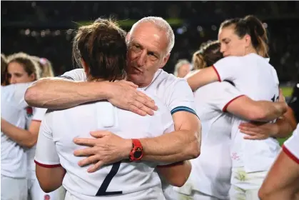  ?? Photograph: Hannah Peters/World Rugby/Getty Images ?? Simon Middleton commiserat­es with his players after their defeat in the World Cup final.