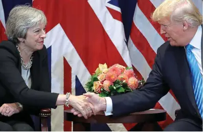  ??  ?? Let’s shake on it: Theresa May with Donald Trump in a meeting at the UN in New York last night