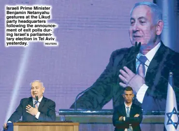  ?? REUTERS ?? Israeli Prime Minister Benjamin Netanyahu gestures at the Likud party headquarte­rs following the announceme­nt of exit polls during Israel’s parliament­ary election in Tel Aviv yesterday.