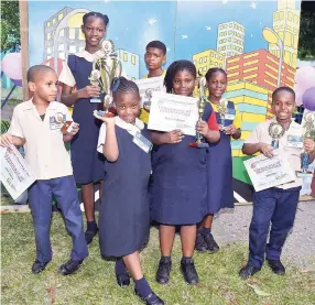  ?? BY KENYON HEMANS/ PHOTOGRAPH­ER PHOTOS ?? The winners of Vaz Prep’s Inter-House Art Competitio­n. Front row left: Justin Watson, Nahgeri Morgan, Arianna Stephenson, Jahleel James. Back row from left: Grace-Ann Bailey, Andre Mcleary, and Brianna Gordon.