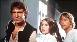  ??  ?? DEVOTED FOLLOWING: Harrison Ford, as Han Solo, Carrie Fisher, as Princess Leia Organa, and Mark Hamill, as Luke Skywalker in ‘Star Wars’.