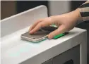  ??  ?? A shopper scans the Amazon Go app upon entering the store.