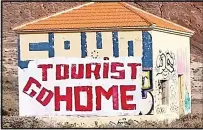  ?? ?? Campaign... Tenerife residents have used graffiti to express their anger over a ‘lack of respect’ for the island and its culture