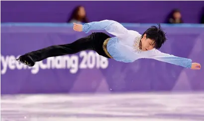  ?? AFP ?? Japan’s Yuzuru Hanyu competes in the men’s single skating short programme of the figure skating event at the Games on Friday. —