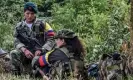  ?? Photograph: Luis Acosta/AFP/ Getty Images ?? Female members of Farc rest at a camp in the Colombian mountains in 2016 before the ceasefire.