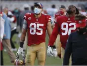  ?? NHAT V. MEYER — BAY AREA NEWS GROUP FILE ?? The San Francisco 49ers’ George Kittle (85) and Kerry Hyder Jr. (92) leave the field following their 43-17loss to the Miami Dolphins at Levi’s Stadium in Santa Clara on Oct. 10, 2020.