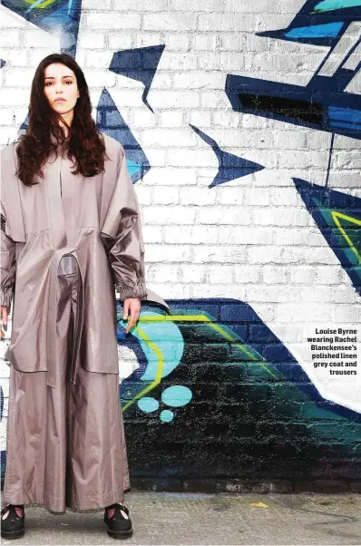  ??  ?? Louise Byrne wearing Rachel Blanckense­e’s polished linen grey coat and trousers