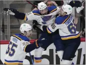  ?? DAVID ZALUBOWSKI — THE ASSOCIATED PRESS ?? St. Louis’ Tyler Bozak, middle, celebrates his overtime goal against Colorado with Colton Parayko, left, and Alexei Toropchenk­o in Game 5of the second-round playoff series.