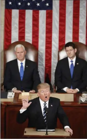  ?? ALEX BRANDON — THE ASSOCIATED PRESS ?? President Donald Trump, flanked by Vice President Mike Pence and House Speaker Paul Ryan of Wis., gestures as he addresses a joint session of Congress on Capitol Hill in Washington, Tuesday.