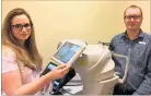  ?? PHOTO / SUPPLIED ?? Specsavers Napier optometris­t Scott Charlton (right) with their new hospitalgr­ade 3D diagnostic technology, OCT (Optical Coherence Tomography) which will enable them to obtain detailed informatio­n about the eye.