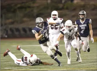  ?? File photo ?? Cents running back Quinn Sheaffer (24) dodges a tackle as he runs up the field during the CIF-SS Division 6 semifinals against Bishop Garcia Diego High School at College of the Canyons on Nov. 24, 2017.