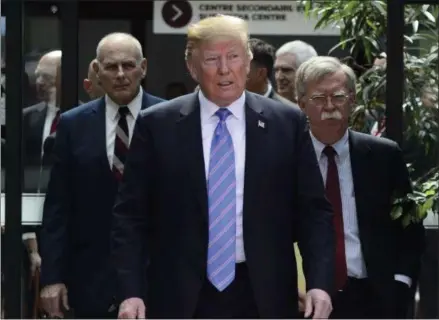  ?? SEAN KILPATRICK — THE CANADIAN PRESS VIA AP ?? U.S. President Donald Trump leaves the G-7 Leaders Summit in La Malbaie, Quebec, on Saturday, with White House Chief of Staff John Kelly, left, and National Security Adviser John Bolton.