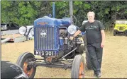  ?? ?? Father and daughter Tim and Lucy Wale with Fordson tractors 1949 E27N and 1961 Super Major