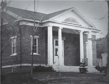  ?? File photo ?? The former Trumbull town library, which was converted into a private home, is on the market. Top and bottom, the home makes use of its beautiful woodwork. Above, the building in its original incarnatio­n.