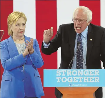  ?? STAFF PHOTO BY NANCY LANE ?? ‘IT WAS TIME’: Presumptiv­e Democratic candidate for president Hillary Clinton is endorsed by primary rival Bernie Sanders in Portsmouth, N.H., yesterday.