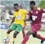  ?? KAVARLY ARNOLD/PHOTOGRAPH­ERK ?? Khamali Burley of Petersfiel­d High School (left) attempting to dribble away from Port Antonio High School’s Okeitho James in their semifinal encounter.