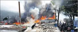  ?? PICTURE AYANDA NDAMANE ?? The fire at the Mandela Park informal settlement near Hout Bay last month. Animal rescue group Darg rescued 106 animals and saw dozens of dead cats and dogs in the cinders.